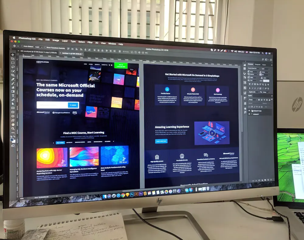 Website design mockups and layout sketches on a workspace